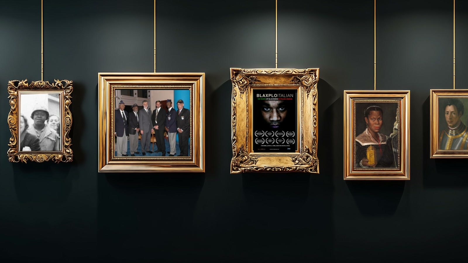 Film still: a dark wall of gilt frames hanging on cords, holding photographs and film posters, among them Blaxploitalian