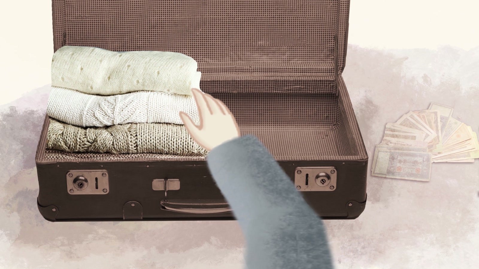 Film still: a hand laying folded sweaters in an open suitcase, banknotes beside it